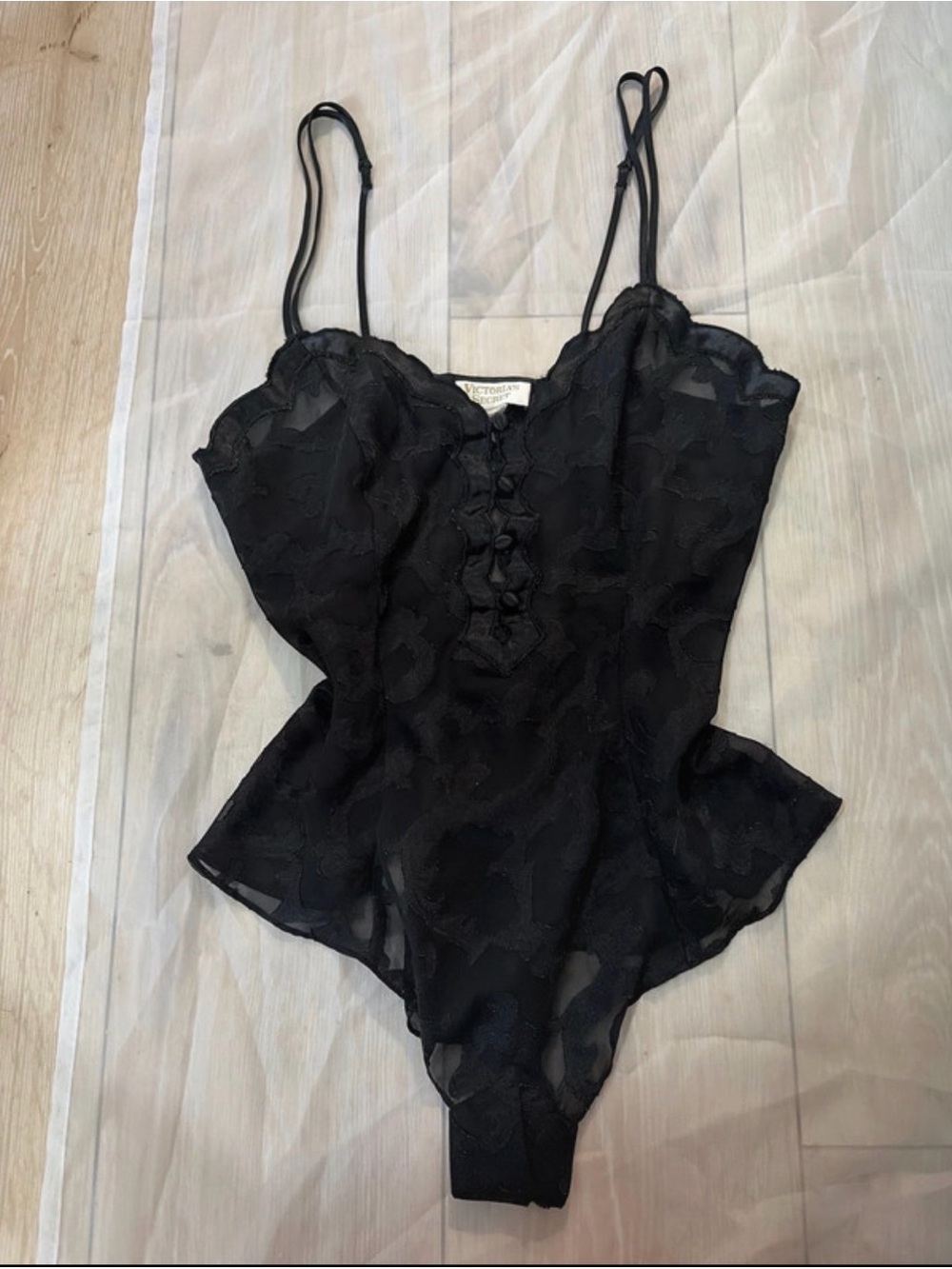 Gold tag vintage Victoria’s Secret black body suit.